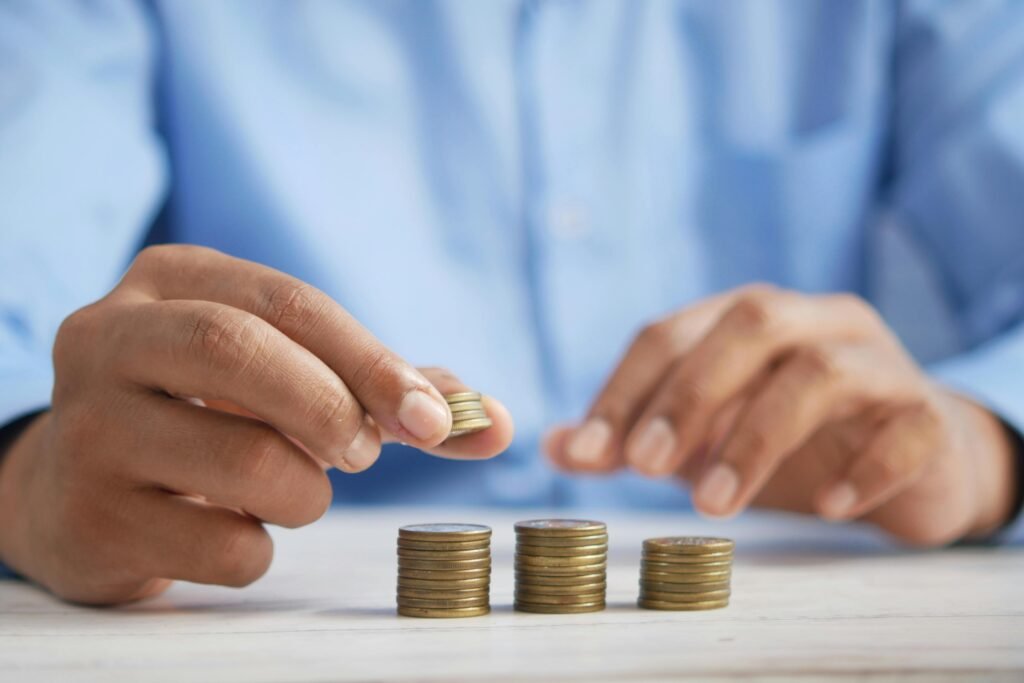 A person making a stack of coins