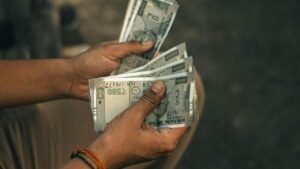 Some five hundred rupees notes on hands shown as countiing