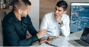 A person consulting on investment with another person