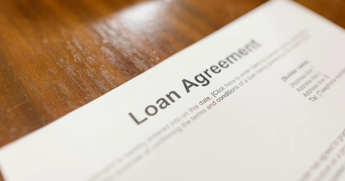 A loan agreement form on a table